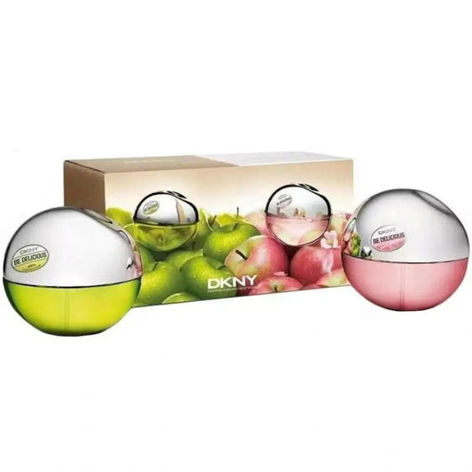 DKNY perfume set with green and pink bottles and a box featuring apples on a white background