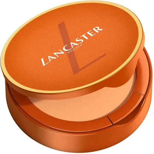 Orange compact powder with Lancaster logo on a white background